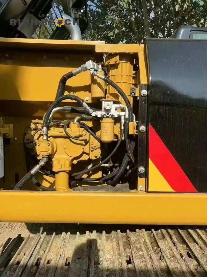 Rear view of a 2010 Caterpillar 320D excavator with 2,300 hours, listed for $18,056